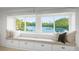 Large window seat with drawers, cushions and a beautiful view of the lake at 8988 Houston Pl # 303, Orlando, FL 32819