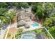 Attractive aerial view of a home with a beautiful cabana, pool, landscaped yard, and brick driveway at 100 Crestwood Dr, Longwood, FL 32779