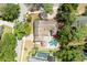 Stunning aerial view of home with a private pool, cabana, landscaped yard, and brick paver driveway at 100 Crestwood Dr, Longwood, FL 32779