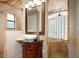 Bathroom featuring a vessel sink, custom vanity, and tile work providing a luxurious feel at 100 Crestwood Dr, Longwood, FL 32779