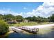 Gorgeous lake view with a dock leading to a sandy beach and park at 100 Crestwood Dr, Longwood, FL 32779