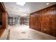 Bright sunroom with wood paneled walls and glass ceiling, offering natural light and backyard views at 100 Crestwood Dr, Longwood, FL 32779
