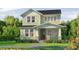 Charming two-story home with a well-manicured lawn and beautiful landscaping at 10043 Dulbecco St, Orlando, FL 32827