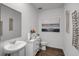 Bathroom featuring a pedestal sink, vanity, and modern decor at 1012 Bear Hammock Dr, Umatilla, FL 32784