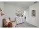 Cozy Bedroom with plush chair, stylish changing table, and neutral decor at 1012 Bear Hammock Dr, Umatilla, FL 32784