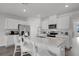 Spacious kitchen featuring a large island, stainless steel appliances, and modern fixtures at 1012 Bear Hammock Dr, Umatilla, FL 32784