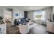 Bright and airy living room with modern furnishings, stylish decor, and a large window with natural light at 1012 Bear Hammock Dr, Umatilla, FL 32784