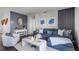 Comfortable living room featuring a plush sofa, elegant decor, a large window, and contemporary furniture at 1012 Bear Hammock Dr, Umatilla, FL 32784