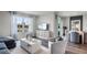 Open concept living area with stylish seating, dining area, modern decor, and ample natural light at 1012 Bear Hammock Dr, Umatilla, FL 32784