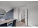 Office with a modern desk setup and a view into the hallway at 1012 Bear Hammock Dr, Umatilla, FL 32784