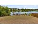 Waterfront backyard with lake views and a wooden pier, perfect for relaxation at 1103 Saddleback Ridge Rd, Apopka, FL 32703