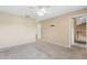 Second bedroom with neutral carpeting; view of staircase visible outside door at 1103 Saddleback Ridge Rd, Apopka, FL 32703