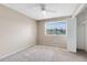 Bright bedroom features neutral carpet and a window providing natural light at 1103 Saddleback Ridge Rd, Apopka, FL 32703