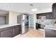Modern kitchen with stainless steel appliances, tile flooring, and ample counter space at 1103 Saddleback Ridge Rd, Apopka, FL 32703