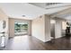 Bright living room with lake view, wood floors, and convenient access to the back deck at 1103 Saddleback Ridge Rd, Apopka, FL 32703