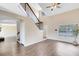 Bright living room featuring vaulted ceilings, wood floors, and ample natural light at 1103 Saddleback Ridge Rd, Apopka, FL 32703
