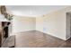 Spacious living room featuring wood flooring, a brick fireplace, and neutral color scheme at 1103 Saddleback Ridge Rd, Apopka, FL 32703