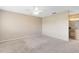 Spacious primary bedroom featuring neutral carpeting and ensuite bath at 1103 Saddleback Ridge Rd, Apopka, FL 32703
