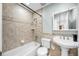 Updated bathroom with tiled shower, vanity and decorative mirror at 1231 Glastonberry Rd, Maitland, FL 32751