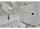 Modern bathroom with white subway tiles, patterned floor, and glass-enclosed shower at 1231 Glastonberry Rd, Maitland, FL 32751