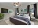 Comfortable bedroom with a plush rug, decorative lamps, and ample natural light at 1231 Glastonberry Rd, Maitland, FL 32751
