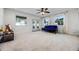 Bright and spacious bedroom with neutral carpet, french doors, and a ceiling fan, creating a comfortable retreat at 1231 Glastonberry Rd, Maitland, FL 32751