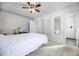 Serene bedroom with soft carpet, neutral walls, and an en-suite bathroom featuring a modern shower at 1231 Glastonberry Rd, Maitland, FL 32751
