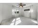 Bright bedroom with white carpet, ceiling fan, and natural light from two windows at 1231 Glastonberry Rd, Maitland, FL 32751