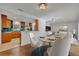 Dining room with a marble table, seating for four, and an open view of the kitchen at 1231 Glastonberry Rd, Maitland, FL 32751