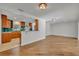Open-concept kitchen featuring wood cabinets, granite countertops and an eat in bar area at 1231 Glastonberry Rd, Maitland, FL 32751