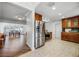 Kitchen with stainless steel refrigerator, view to dining area and custom wood cabinets at 1231 Glastonberry Rd, Maitland, FL 32751