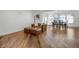 Open living area with hardwood floors connecting the living room and dining space at 1231 Glastonberry Rd, Maitland, FL 32751