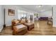 Spacious living room featuring hardwood floors, recessed lighting, and a modern open layout perfect for entertaining at 1231 Glastonberry Rd, Maitland, FL 32751