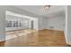 Spacious living area with natural light, hardwood floors, and adjacent dining space at 1231 Glastonberry Rd, Maitland, FL 32751