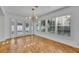 Bright living room featuring hardwood floors, natural light, modern lighting, and French doors to the backyard at 1231 Glastonberry Rd, Maitland, FL 32751