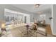 Bright, open-concept living room and dining area with hardwood floors and stylish furnishings at 1231 Glastonberry Rd, Maitland, FL 32751
