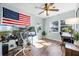 Well-lit home office featuring multiple monitors, ceiling fan and hardwood floors at 1231 Glastonberry Rd, Maitland, FL 32751