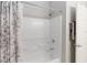 Bathroom featuring a tub with an overhead shower and a white shower curtain at 12335 Sumter Dr, Orlando, FL 32824