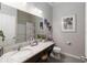 Bathroom featuring a granite vanity and framed mirror above the sink at 12335 Sumter Dr, Orlando, FL 32824