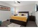 Bright bedroom with a large window and dark-stained furniture at 12335 Sumter Dr, Orlando, FL 32824