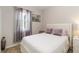 Cozy bedroom featuring soft natural light, plush carpet, and neutral decor at 12335 Sumter Dr, Orlando, FL 32824