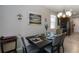 Dining room with chandelier, seating for four, and neutral décor at 12335 Sumter Dr, Orlando, FL 32824