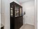 Hallway area featuring a cabinet and doorway at 12335 Sumter Dr, Orlando, FL 32824