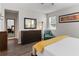 Bright main bedroom featuring a dresser, mirror, and turquoise chair at 12335 Sumter Dr, Orlando, FL 32824