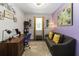 Office area featuring desk, seating, and grey sofa at 12335 Sumter Dr, Orlando, FL 32824