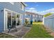 Private backyard featuring a concrete patio and lawn, perfect for outdoor relaxation and entertaining at 135 Orchid Dr, Davenport, FL 33897