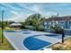 Basketball court surrounded by greenery and a picnic area with a blue and grey design at 135 Orchid Dr, Davenport, FL 33897