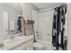 Well-lit bathroom with a shower-tub combo and matching fixtures at 135 Orchid Dr, Davenport, FL 33897