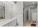 Bright bathroom with a marble countertop, an enclosed shower, and lots of storage at 135 Orchid Dr, Davenport, FL 33897