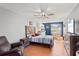 Spacious bedroom with a ceiling fan, an eat-in kitchen, and a TV at 135 Orchid Dr, Davenport, FL 33897